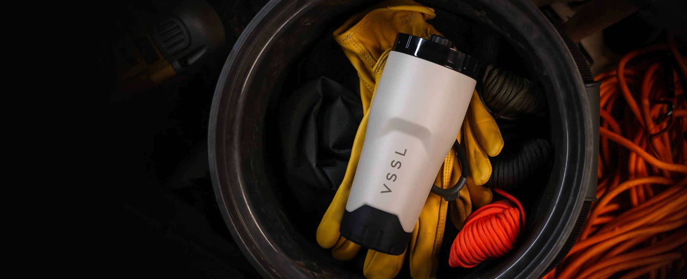 VSSL Rift Tumbler packed in a truck gear bucket with work gloves and rope