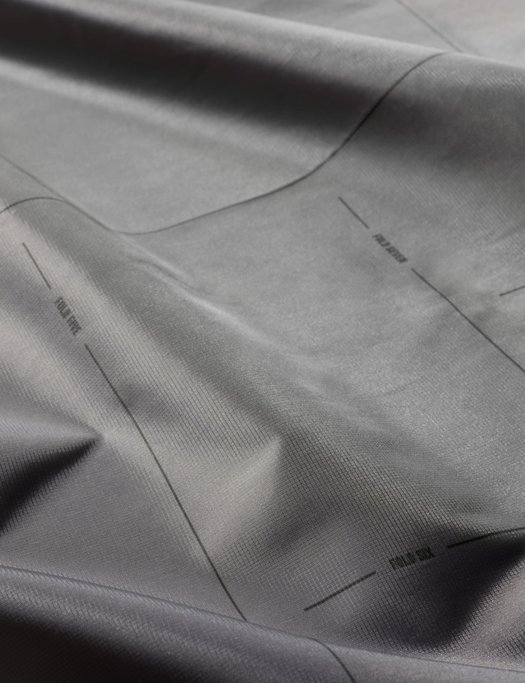 Matador Pocket Blanket™ 4.0 - 160 x 110cm in Ghost Grey - close-up of gray fabric with subtle texture
