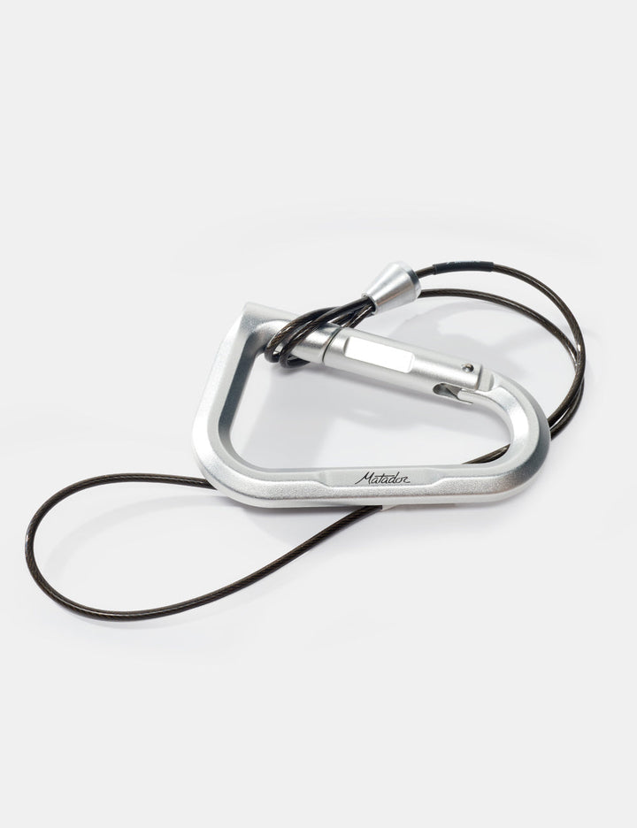 Matador BetaLock Accessory Cable (60cm) - silver carabiner with a black cord on a white background