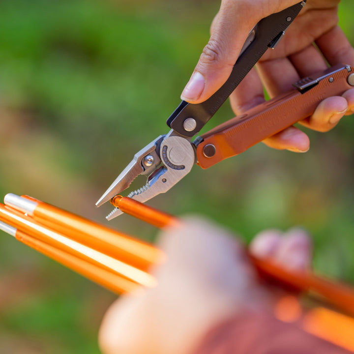 Leatherman Rebar - pliers straightening a tent pole at camp - Nitecore Singapore